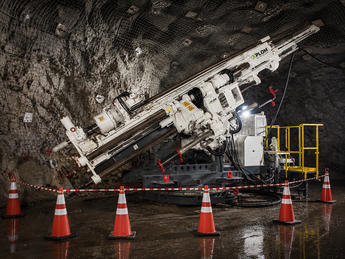 Underground diamond core drilling operation in mine tunnel