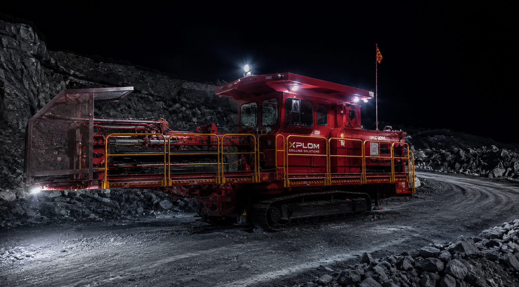 XPLOM engineers monitoring subhorizontal RC rig drilling into open pit wall