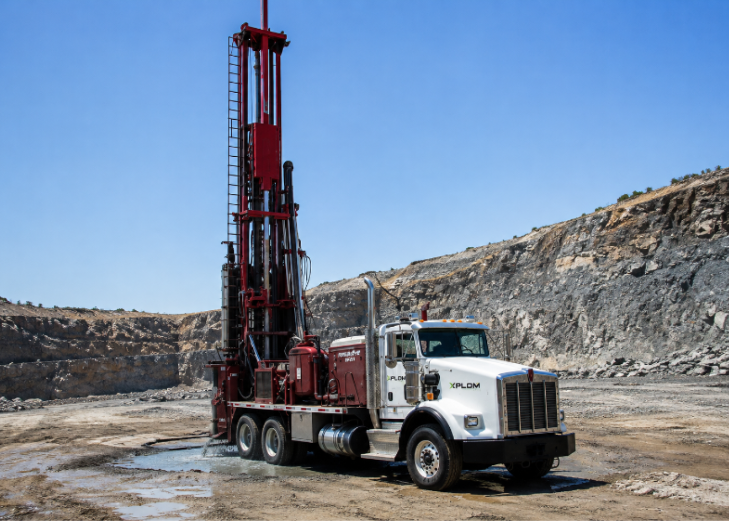 XPLOM water well drilling crew on site